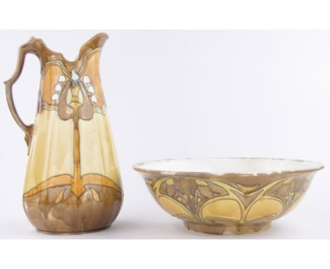 A Minton Secessionist pottery wash jug and basin set,tube-lined stylised Art Nouveau designs, bowl diameter 39cm, jug height 
