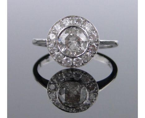 An 18ct white gold diamond cluster ring,total diamond content approx. 1.5cts, centre stone 6mm across, setting 12mm diameter,