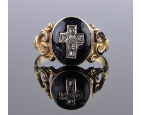 A 19th century unmarked gold memorial ring,the diamond and enamel cross panel opening to reveal a compartment, panel height 1