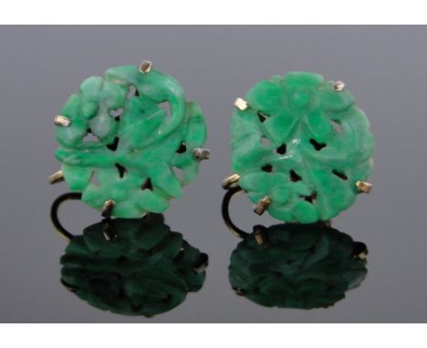 A pair of Chinese carved and pierced jade screw-on earrings,10ct gold settings, panels 15mm diameter.