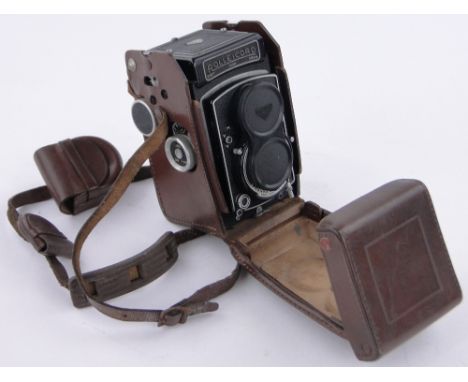 A Rolleicord twin lens reflex camera,leather cased and a Cannon AE-1 35mm camera, (2).