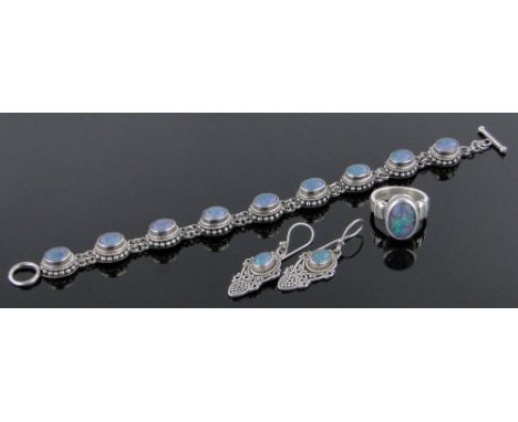 An opal set continental silver bracelet,with matching earrings and ring.