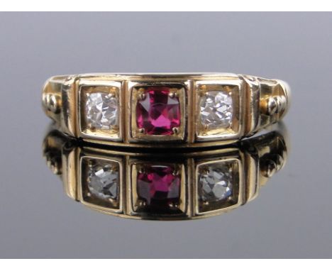 An 18ct gold 3 stone ruby and diamond ring,size Q.