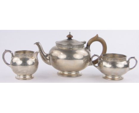 A 3-piece heavy gauge silver teaset,with cast Celtic bands, makers marks R & S Ltd., London 1965, gross weight 39 oz.