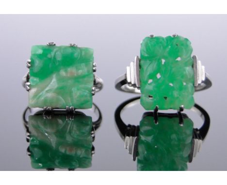 2 Chinese carved and pierced jade set rings,unmarked white metal settings.