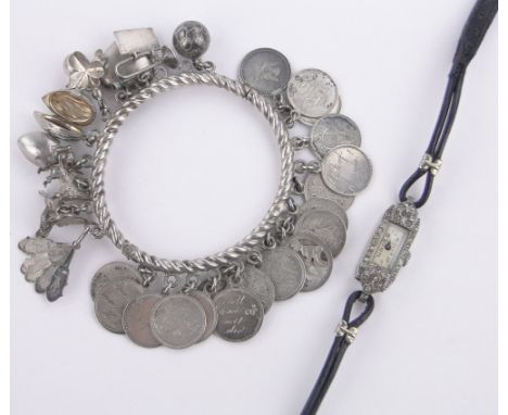 A continental silver and coin mounted charm bangle,and an Art Deco paste set cocktail wristwatch, (2).