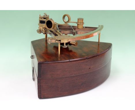 A 19th Century brass sextant. By B Wood Liverpool - silvered scale. Contained in period mahogany case with lenses bearing ret