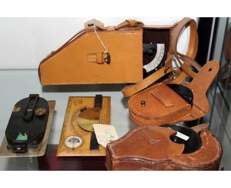 A 3” prismatic sighting compass by Stanley - London together with a U.S.C>E 1942 elevation sight, a clinometer, a Verners com