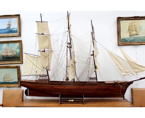A good scratch built model of the Cutty Sark of impressive scale measuring approximately 12ft long. Traditional mahogany plan