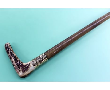 A child’s rhinoceros horn riding crop with 12ct gold mount. Dated 1868 71cm long.
N.B.Non EU buyers please note that it is un