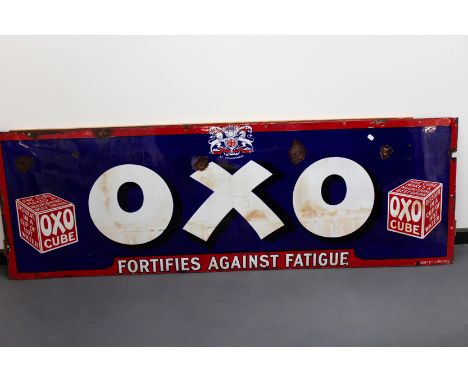 An enamel advertising sign. “Oxo - Fortifies against fatigue”. 183 x 61cm.