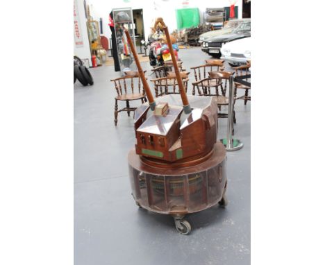 A good cutaway illuminating and moving scale wooden model of a 6" MK26 naval gun turret, the perspex top allowing viewing of 