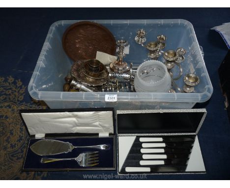 A quantity of plated items including candelabra, trays, toast racks, boxed cake knife, fork etc.