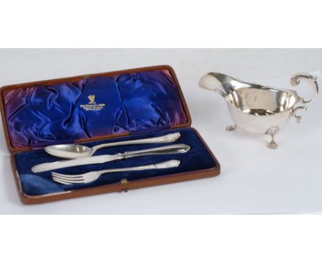 GEORGE V MATCHED THREE PIECE CHILD'S SILVER CUTLERY SET, in case, initialled, Sheffield 1932 and 1934, (knife and fork matchi