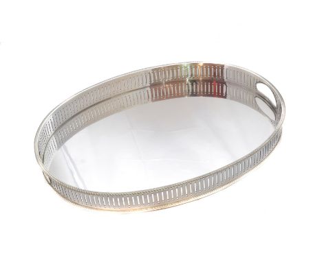An Elizabeth II silver tray, of oval outline, with pierced sides, twin handles and gadrooned rim, raised on four bun feet, ha