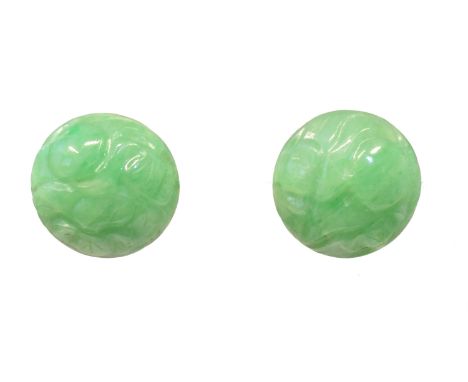 A pair of carved jade earrings, each designed as a circular jade carving depicting flora and fauna, length 1.2cm, gross weigh