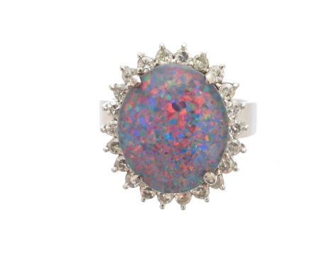 A synthetic opal triplet and diamond cluster ring, the oval synthetic opal triplet within a single cut diamond surround, stam