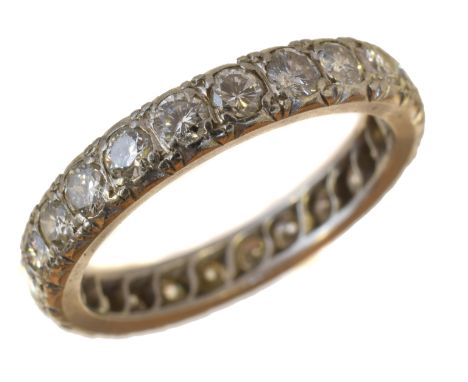 A diamond eternity ring, the brilliant cut diamond line claw set into the polished band, estimated total diamond weight 1.60c