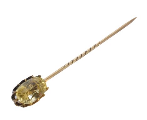 A sapphire stick pin, the oval shape yellow sapphire weighing approximately 6.50cts within a twelve claw setting, length of s