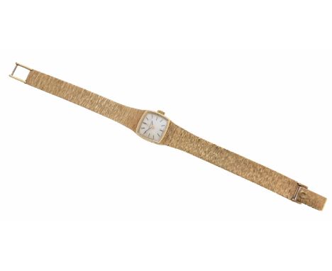 A 1970's 9ct gold Omega ladies automatic wristwatch, the cushion shape white signed dial with baton hour markers, within a 9c