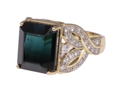 An 18ct gold tourmaline and diamond dress ring, the rectangular shape indicolite tourmaline with brilliant cut diamond openwo