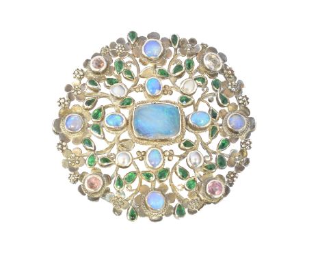 An Arts &amp; Crafts opal and vari gem brooch attributed to Arthur and Georgie Gaskin, the central rectangular opal within an