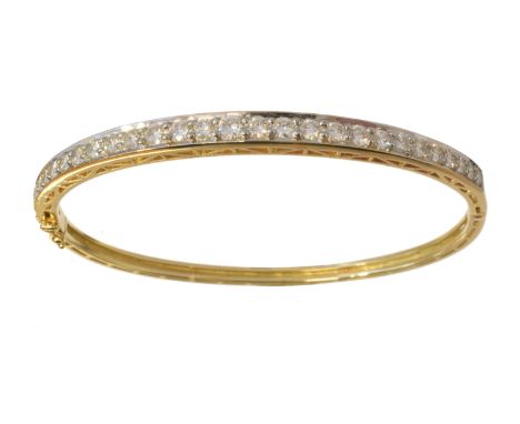 A diamond hinged bangle, the graduated brilliant cut diamond line with plain reverse, stamped 750, total diamond weight 2cts,