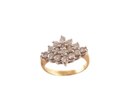 An 18ct gold diamond cluster ring, the brilliant cut diamond line with similarly cut diamond graduated sides, import marks fo