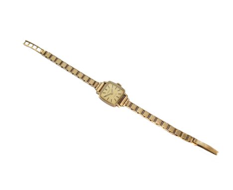 A 1960s ladies 9ct gold Tissot 'Stylist' wristwatch, the square signed gold-tone dial with baton numerals, 17 jewel signed mo