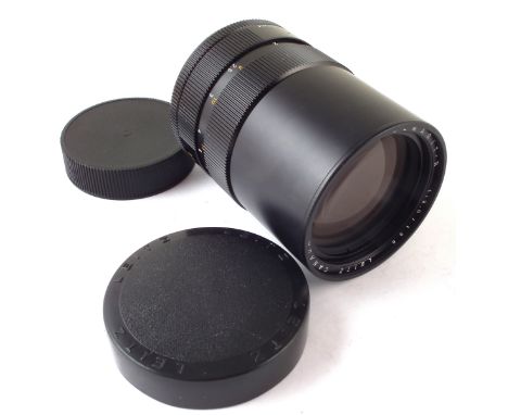 Leitz Elmarit R 1:2.8 / 135mm lens, serial number 3135728, with body and lens cap. CONDITION REPORT: The glasses look in good