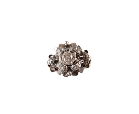 A diamond cluster ring, the brilliant cut diamond, with rose cut diamond quatrefoil accents and scalloped tiered surround, on