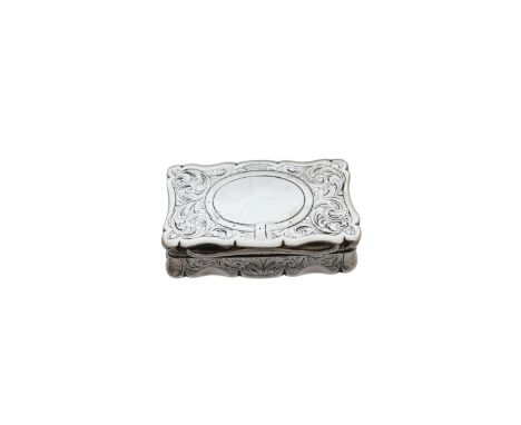 A Victorian silver snuff box, of rectangular form with scrolling border and buckle detail vacant cartouche to the silver gilt