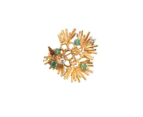 A 1970s emerald and diamond brooch, of abstract design, the brilliant cut diamond and circular shape emerald within an openwo