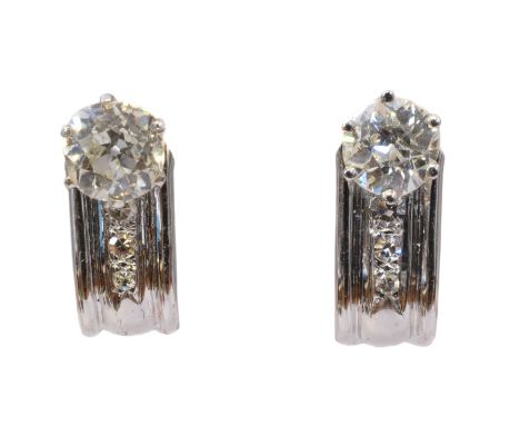 A pair of 18ct gold diamond earrings, each designed as an old cut diamond with single cut diamond line accent atop the convex