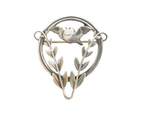 A Georg Jensen brooch, pattern no. 258, designed by Arno Malinowski, the bird in flight with foliate detailing, within an ope