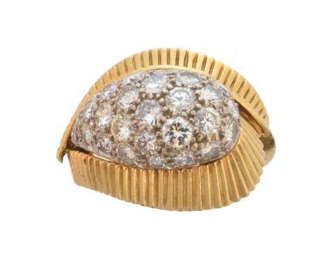 An 18ct gold diamond cluster ring, of asymmetric design, the brilliant cut diamond dome with grooved crossover surround, hall