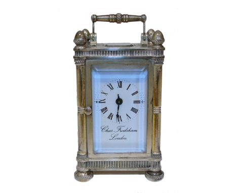 A Charles Frodsham silver cased carriage clock, the white signed dial with Roman numeral hour markers, within a silver case w