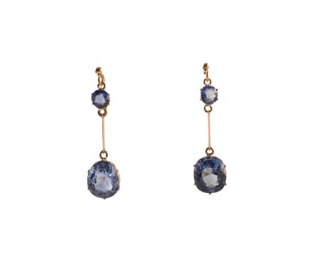 A pair of Sri Lankan sapphire drop earrings, each designed as a cushion shape sapphire weighing 5.50 and 6.20cts respectively