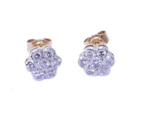 A pair of 18ct gold diamond cluster earrings, of floral design, the brilliant cut diamond within a similarly cut diamond surr