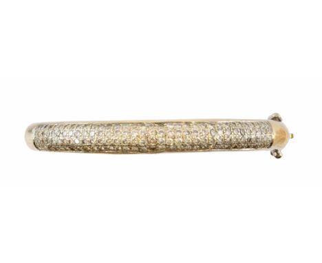 An 18ct gold diamond hinged bangle, the pavé set diamond bangle with polished hinged reverse, hallmarks for London, 2006, est