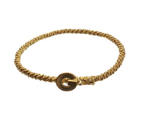 A 9ct gold initial bangle, the polished 'G' atop the rope twist bangle, stamped 9ct, length of inner diameter 5.3cm, gross we