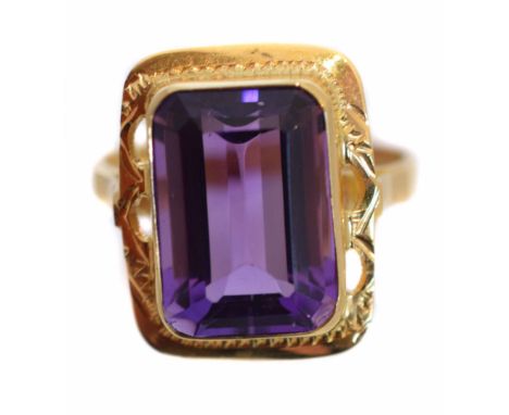 An amethyst single stone ring, the rectangular shape amethyst within a similar shape surround, ring size R1/2, gross weight 5