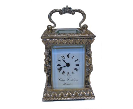 A Charles Frodsham silver cased carriage clock, the white signed dial with Roman numerals, bevelled glass, scroll swing handl