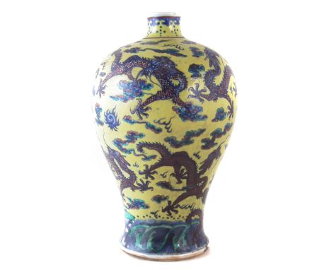 Chinese vase, painted with dragons chasing flaming pearls, with later Victorian yellow over glaze decoration, late 19 th cent