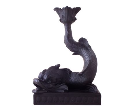 Wedgwood black basalt dolphin candlestick, set on shell moulded base, 22.5cm high CONDITION REPORT: small chip to the top, ou