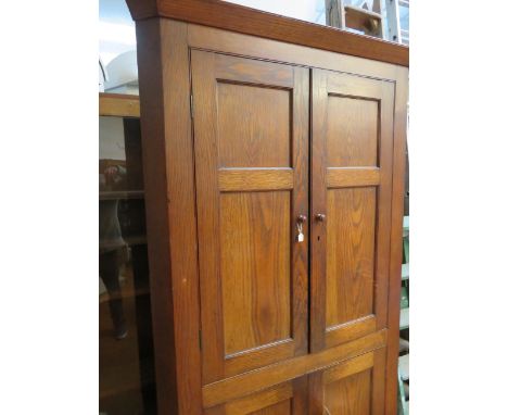 Early 20th century light oak free standing corner cupboard approx 7ft tall