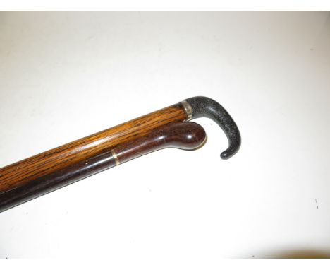 9ct Gold rim swagger stick together with a silver rim walking stick 