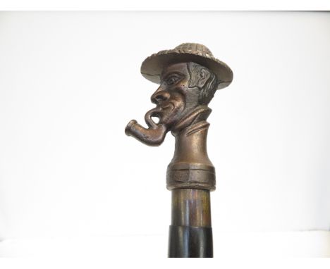 Walking stick with handle depicting Sherlock Holmes 