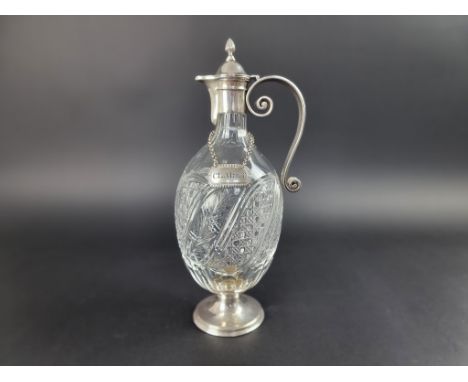 A silver mounted cut glass claret jug, by&nbsp;Edward Barnard &amp; Sons Ltd, London 1911, 34cm high; together with a decante