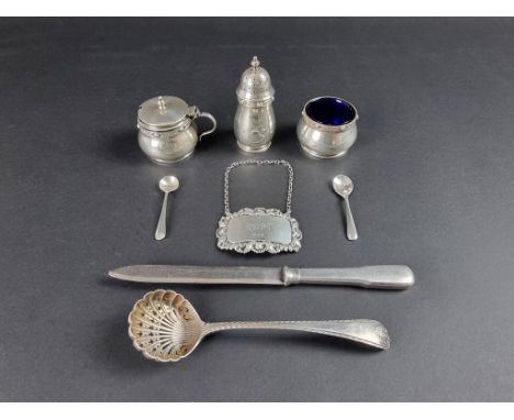 A silver three piece condiment&nbsp;set, by&nbsp;Reid &amp; Sons, Birmingham 1938; together with a silver 'Port' label; a sil